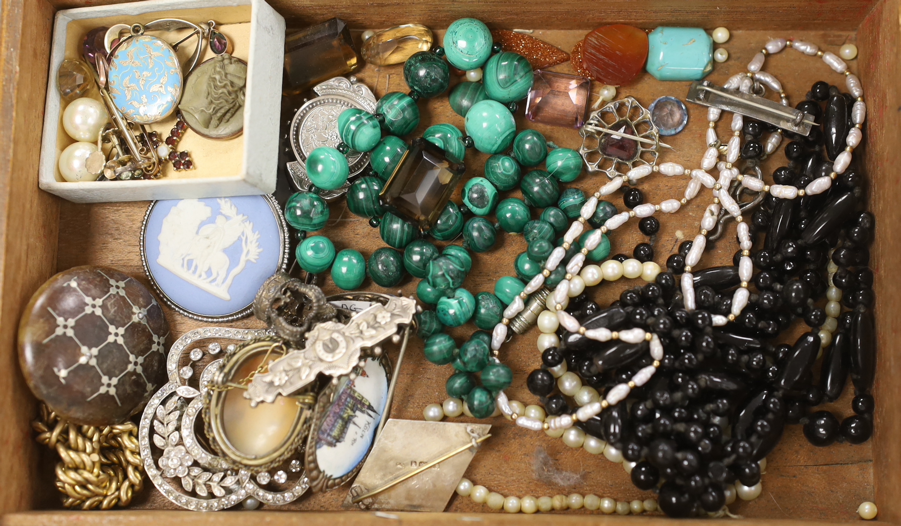 A small group of assorted mainly late 19th century jewellery, including two silver brooches, mourning brooch, malachite necklace, 800 bangle, paste set brooches, 9ct and gem set pendant, enamelled mourning locket, lave b